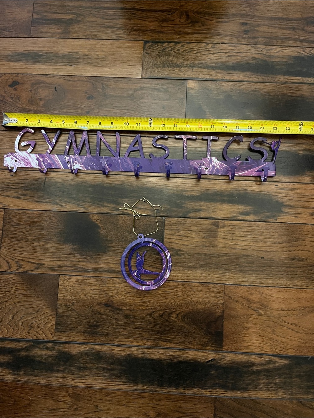 Purple Gymnastics Metal Medal Hanger Set with gymnastics figure ornament.
